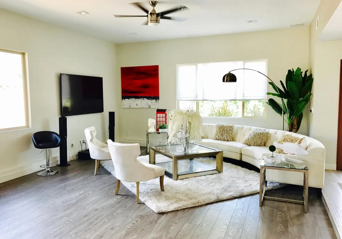 A clean, freshly painted wall with crisp edges and a mounted TV.